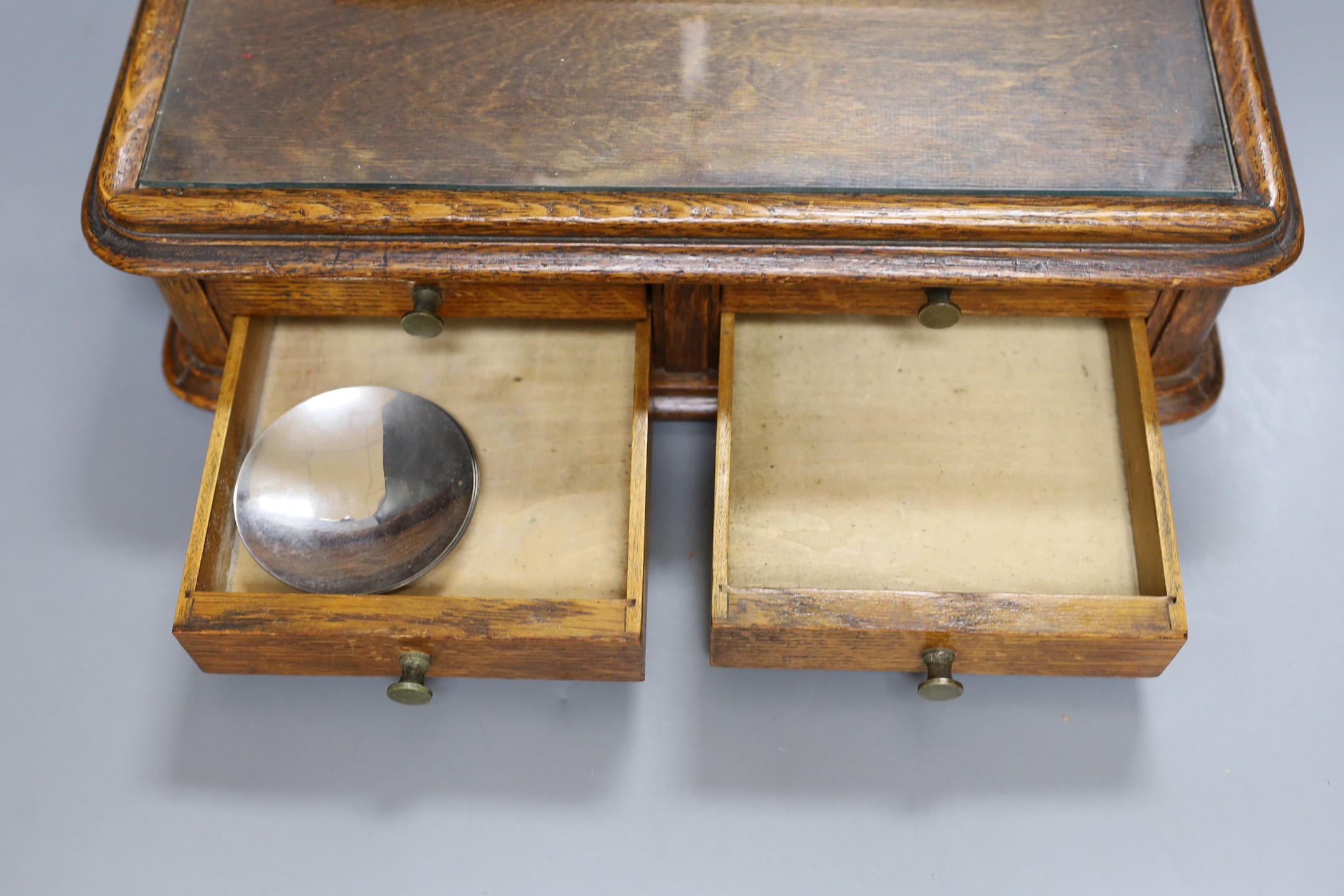 A Victorian oak instrument stand and a set of Stanley scales with weights